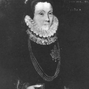 Portrait of Anne Bacon Looking at towards audience. She is wearing a ruffled collar over a dress with jewellery. She is holding a small book in her right hand.