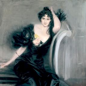 Photo of a painting of Lady Colin Campbell by Giovanni Boldini, 1894. She sits on a sofa, looking enigmatically at the viewer, her head on her right hand while the elbow rests on the sofa's arm. Her body is elongated, in a long black satin dress with huge frills at the shoulders; her dark curly hair is piled on top of her head. This portrait caused a furore when first acquired and exhibited at the National Portrait Gallery.