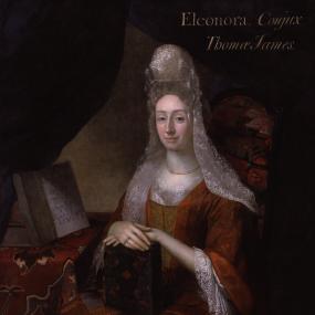 Portrait of Elinor James by an unidentified artist, c. 1690. She sits in a high-backed upholstered armchair by a table covered with a cloth, each boldly patterned. She is wearing a red silk dress with lace at neck and sleeves, and a tall head-dress with lace lappets. She displays several of the works which she wrote, printed, and distributed, including a splendidly bound copy of "Mrs. James's Vindication of the Church of England".