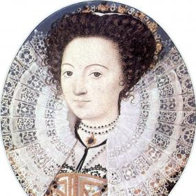 Photograph of a miniature painting of Aemilia Lanyer by Nicholas Hilliard, shown from the shoulders up, wearing a white gown with gold and black lacing, white and black beaded necklaces, and a broad lace ruff that fills most of the oval portrait. Her dark curly hair is pulled back by a low crown of white and black beads and gold.