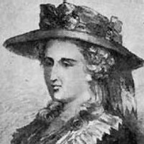 Black and white photograph of a painting of Ann Radcliffe, shown from the waist up, wearing a dark dress with a light frilled collar.  Her curly hair is topped with a large hat that is decorated with flowers.