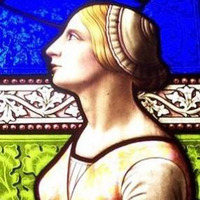 Stained glass window in memory of Margaret Sandbach, by Ballantyne of Edinburgh, in St Digain's Church, Llangernyw, North Wales. She is shown in profile, with her gaze turned upwards, against a colourful background.