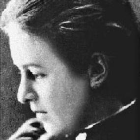 Black and white head-shot of Evelyn Underhill, in profile with her gaze downcast. Her hair is smoothed back.