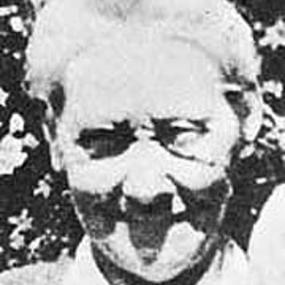 Black and white photo, full face, of Helen Bannerman's head. The image is not very clear, and a strong light produces exaggerated contrasts of light and shade. Bannerman appears to be smiling.