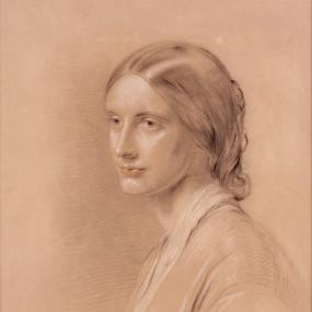 Photograph of a charcoal sketch of Josephine Butler, depicted from the side with her head turned towards the viewer. Her hair is pulled back loosely and she is wearing a simple dress.