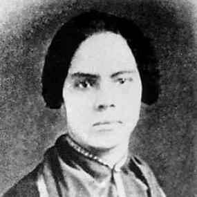 Somewhat blurry black and white photograph of Mary Ann Shadd Cary. She is wearing a top buttoned waistcoat, with the details of her hair not able to be seen, however it seems to be braided back.