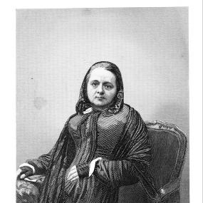 Black and white engraving by J. B. Hunt after a daguerreotype of Caroline Chisholm in her later years by Antoine Claudet. She sits on a chair, wearing a scarf over her hair, a heavy shawl over her dress, and black mittens on her hands. Beneath is reproduced in her handwriting "Yours truly, Caroline Chisholm."
