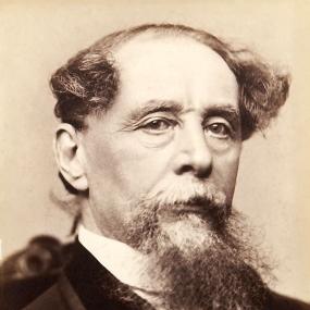 Head-and-shoulders daguerrotype of Charles Dickens by Jeremiah Gurney of New York City, 1867-8. Dickens has a goatee beard, moustache, and hair combed forward on each side of his bald patch.