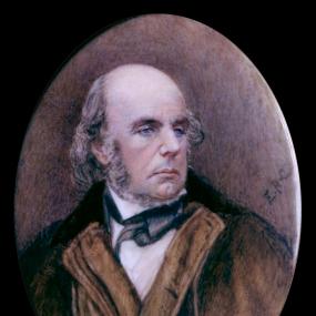 Oval watercolour miniature on ivory of Edward FitzGerald by Eva Mary Bernard (née Orr), Lady Rivett-Carnac, based on a photograph taken in 1873. FitzGerald, largely bald with sideburns, looks to the left; his jacket has a wide brown-velvet collar. National Portrait Gallery, London.