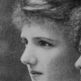 Black and white, close-up photograph of Eva Gore-Booth in profile; it appears to be cropped from a larger group photo. Her hair is bushy and pinned up.