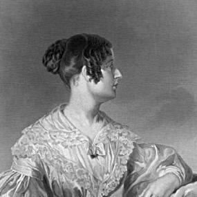 Black and white photograph of a painting of Felicia Hemans, seated with her head turned in profile and her arm resting on a rug draped over her chair, She is wearing a light billowy dress with tight high waist, puffed sleeves, large laced collar, and voluminous skirt. She holds a book or album with clasps.