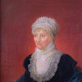 Photograph of a painting of Caroline Herschel by Melchior Gommar Tieleman, 1829. She is shown from the waist up, seated against a red background, and wearing a navy-coloured velvet dress with long sleeves capped at the shoulders, a belt around the waist, and a high, ruffled collar of sheer fabric. She has a matching, ruffled cap on short, blonde hair. A dark blue shawl is wrapped around her arms.