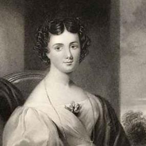 Stipple engraving of Maria Jane Jewsbury by John Cochran after painting by G. Freeman,
published 1847. She is seated, holding a book or paper. Her light dress has large puff sleeves and a sprig of flowers at the bosom; it leaves her shoulders bare. She has a dark shawl wrapped around her, and a long chain necklace. Her dark hair is parted in the centre and arranged in short curls.