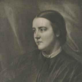 Black and white, head-and-shoulders photo of Sophia Jex-Blake aged twenty-five, a dozen years before she won her struggle for medical qualifications. Backed by dark drapery, she wears a simple, dark, loose-fitting dress with a white collar; her dark hair is pulled back.