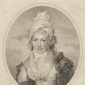 Oval, head-and-shoulders stipple engraving of Sophia Lee by William Ridley after Sir Thomas Lawrence, published 1797. She is wearing a tall, turban-style white cap over her curled and powdered hair, and a layered cloak over a pale, tightly-laced bodice with a kerchief reaching to her throat and fastened with a bow. Her name ("Miss Lee") is written below.