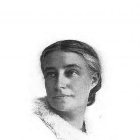 Black and white photograph of Elizabeth Stuart Phelps, that allows only her head to be clearly seen emerging from a white collar which fades into the pale background. Her hair is pulled smoothly back, her head turned alertly a little to the side.