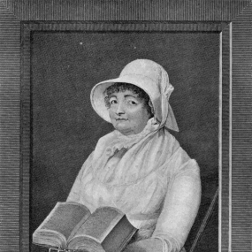Black and white photograph of a portrait of Joanna Southcott by William Sharp, done by 1812. She is seen in a frame, seated, dressed all in white with a hat and a simple dress with high neckline and long sleeves. Her hair is dark and curly. She has a stack of books on her lap, a massive one open on top. National Portrait Gallery.