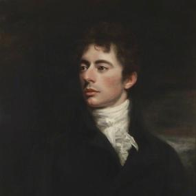Oil painting of Robert Southey from the waist up. He is wearing a black jacket and a white shirt underneath, and he is looking slightly toward the left.