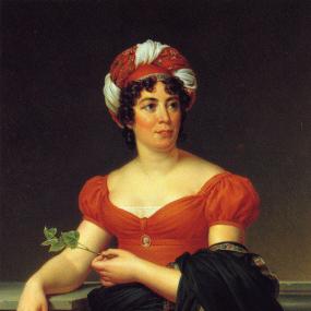 Photograph of the painting of Germaine de Staël by Baron Gérard. Godefroid, 1810. She stands leaning against a stone table. She is wearing a red high-waisted dress with short puff sleeves and a small cameo brooch pinned in the centre of the bust, a black shawl folded over her arm, and a striking red and white turban on her curly hair. She holds a small sprig of green in one hand.