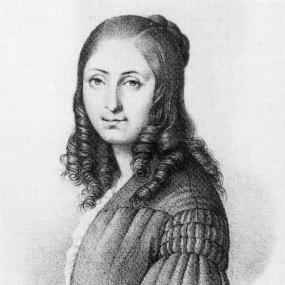 Black and white photograph of a painting of Flora Tristan. She is depicted from the side with her face turned to face the viewer. She is wearing a dress with long flared sleeves that is opened at the front to reveal a light ruffled shirt. Her hair is partially pinned in a bun at the back of her head with the rest of her hair hanging down in ringlets around her face.