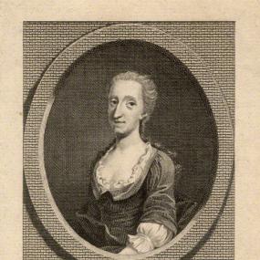 Black and white photograph of a line engraving of Catharine Trotter by an unknown artist, shown from the waist up. She wears a simple dark dress with scooped neckline over a white ruffled chemise. Her light hair is brushed back and hangs down behind her shoulders. The oval portrait is placed as if set into a wall, with a plaque below bearing her married name : "Catharine Cockburn". National Portrait Gallery.