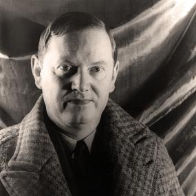 Black and white, full-face, head and shoulders photograph of Evelyn Waugh, taken by Carl Van Vechten on 15 December 1940.