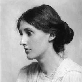 Well-known black and white photograph of Virginia Stephen (later Virginia Woolf), 1902.  She is seen in profile, with her hair loosely caught back in a bun